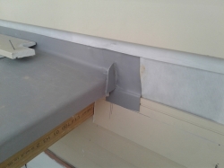 typical roof/wall junction with kickout diverter, note overlap of weatherboard below