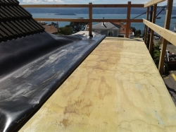 a bit awkward on this roof, no where to stand if whole sheet and plywood glued up