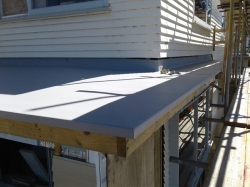 view along west upper level roof with turndowns folded and glued to aluminium drip edge